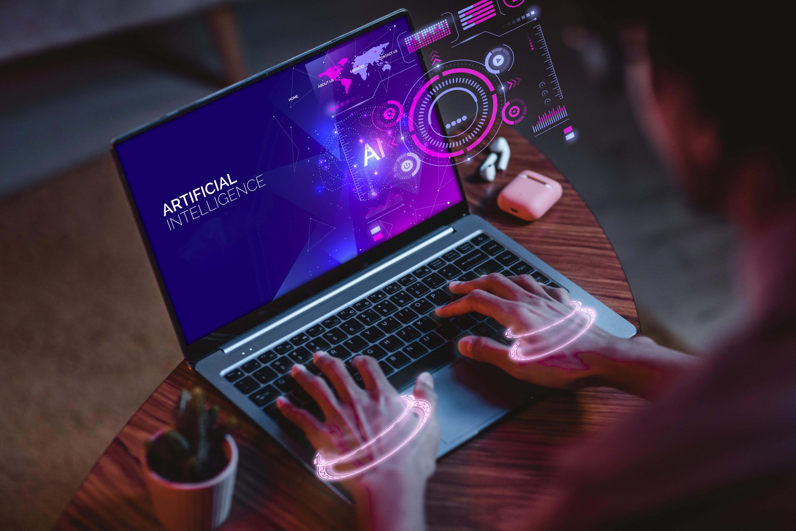 A laptop with the screen displaying the word 'AI' in bold letters, while a person's hand types on the keyboard, symbolizing AI-driven technology and innovation.