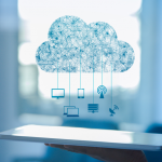 An image of a tablet with a cloud above it, symbolizing data migration, with arrows indicating movement of data from the tablet to the cloud