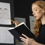 A woman analyzing product architecture language on a digital interface, symbolizing the intersection of design and technology in product development